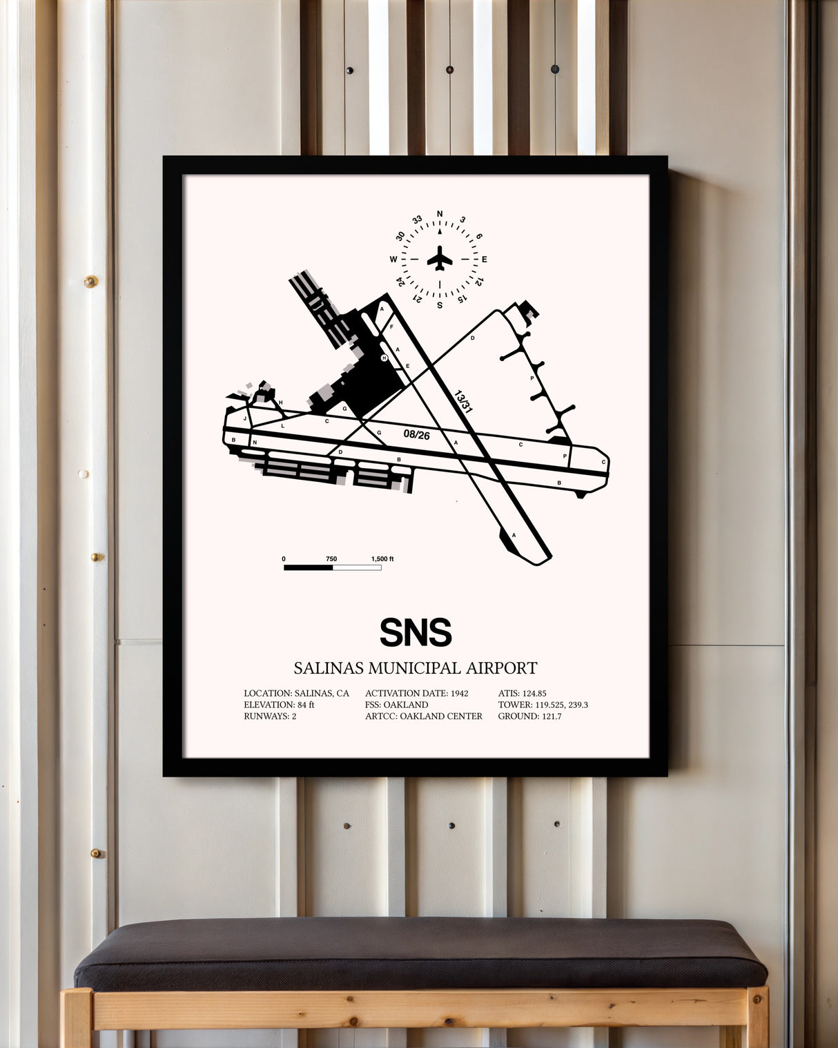 Salinas Municipal Airport framed poster displayed in an airplane hangar
