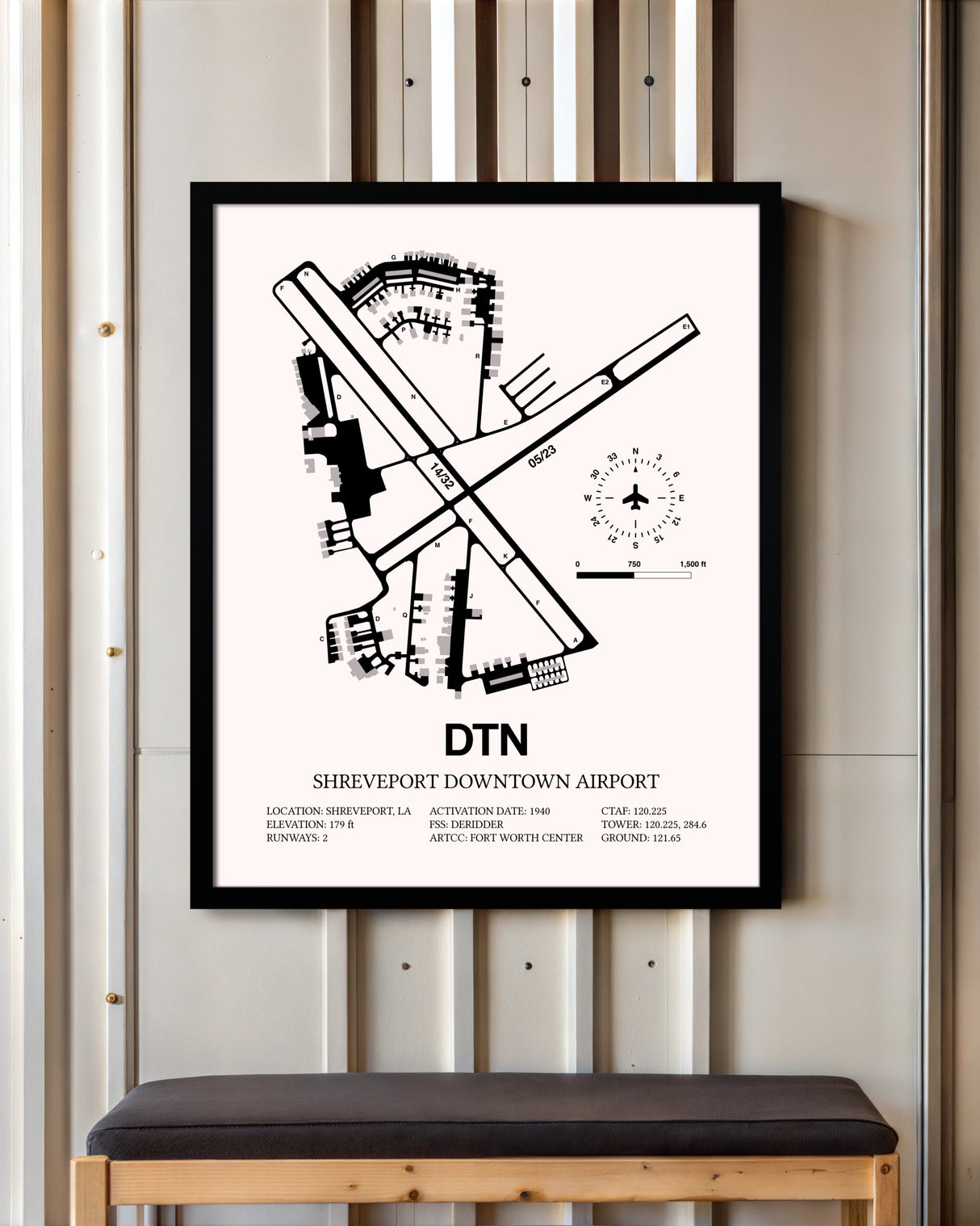 Shreveport Downtown Airport framed poster displayed in an airplane hangar