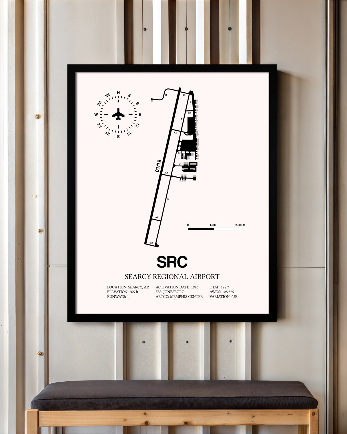 Searcy Regional Airport framed poster displayed in an airplane hangar