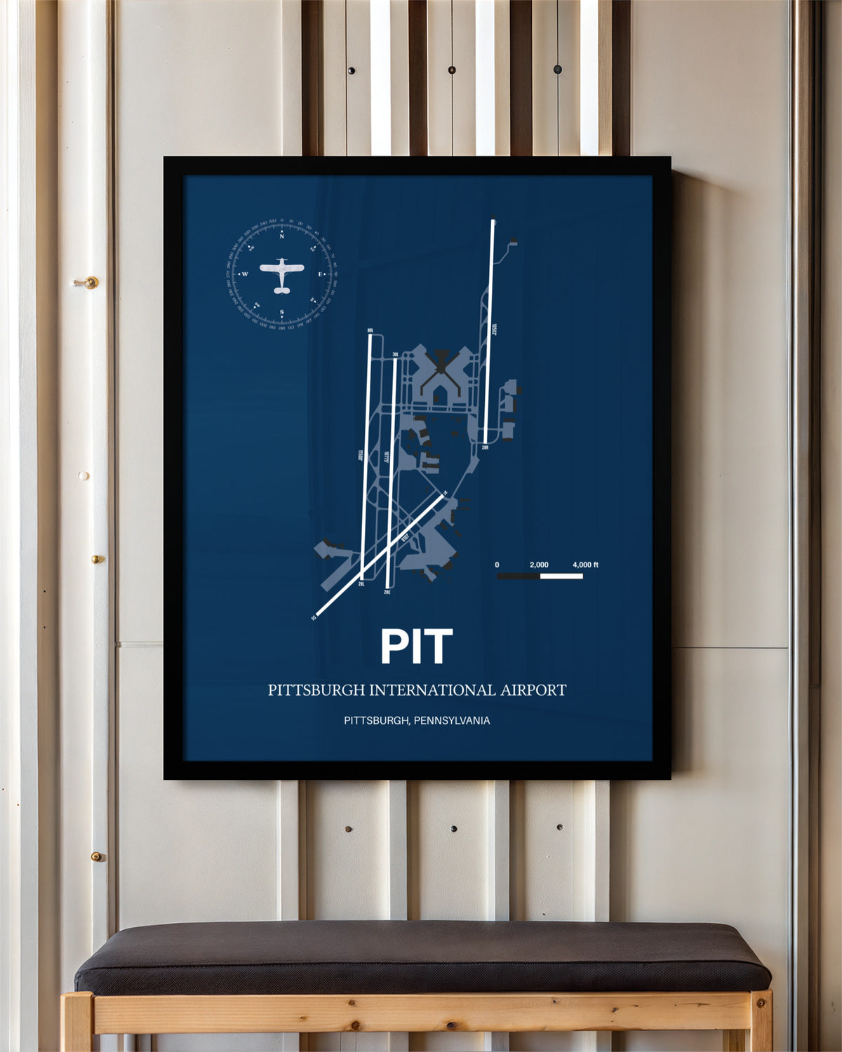 Pittsburgh International Airport framed poster displayed in an airplane hangar