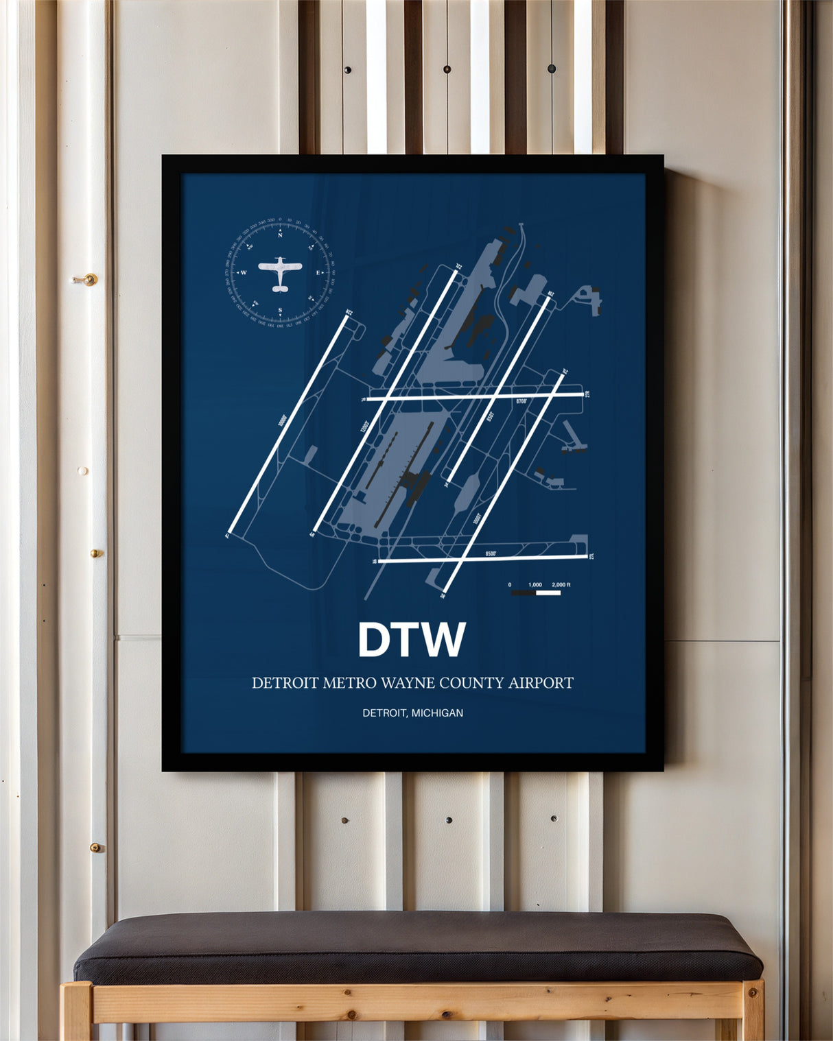 Detroit Metro Wayne County Airport framed poster displayed in an airplane hangar