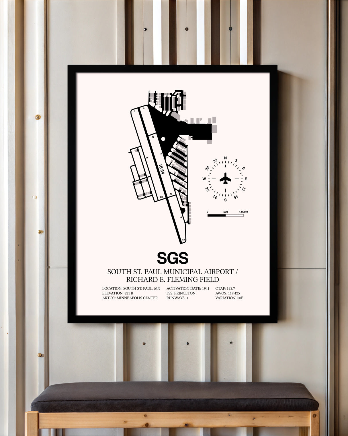 South St. Paul Municipal Airport / Richard E. Fleming Field framed poster displayed in an airplane hangar