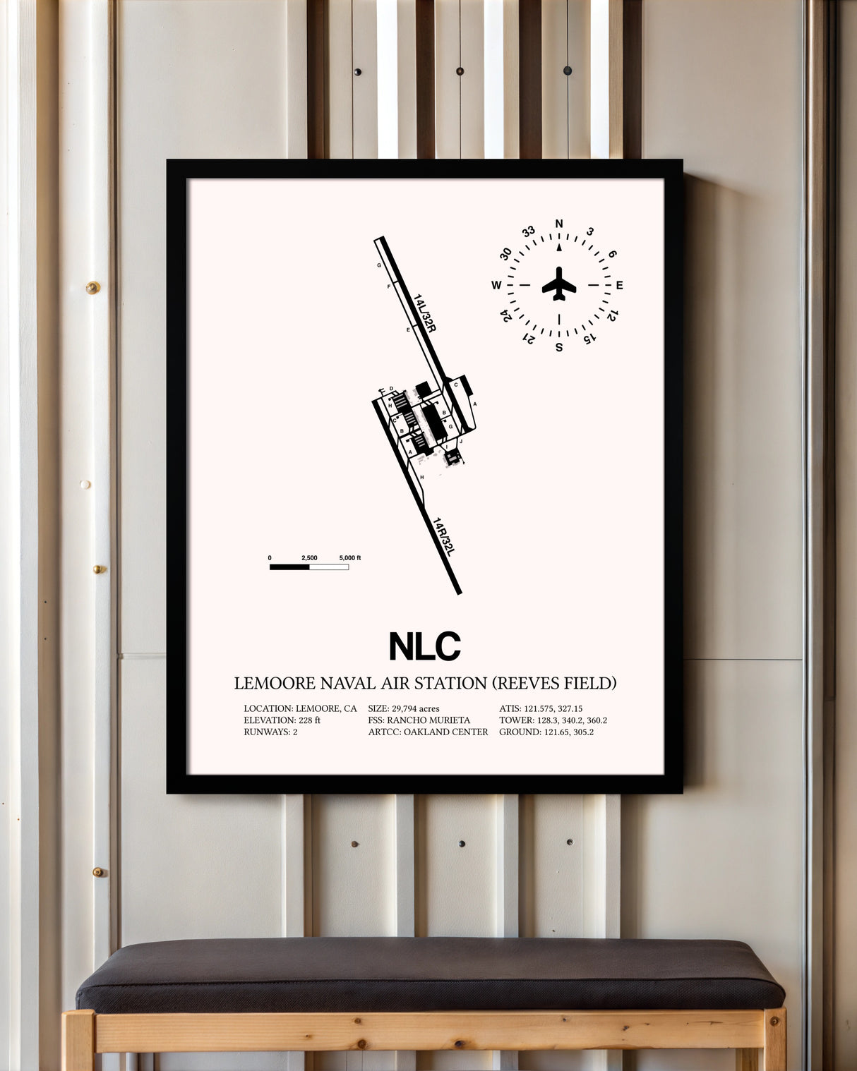 Lemoore Naval Air Station (Reeves Field) framed poster displayed in an airplane hangar