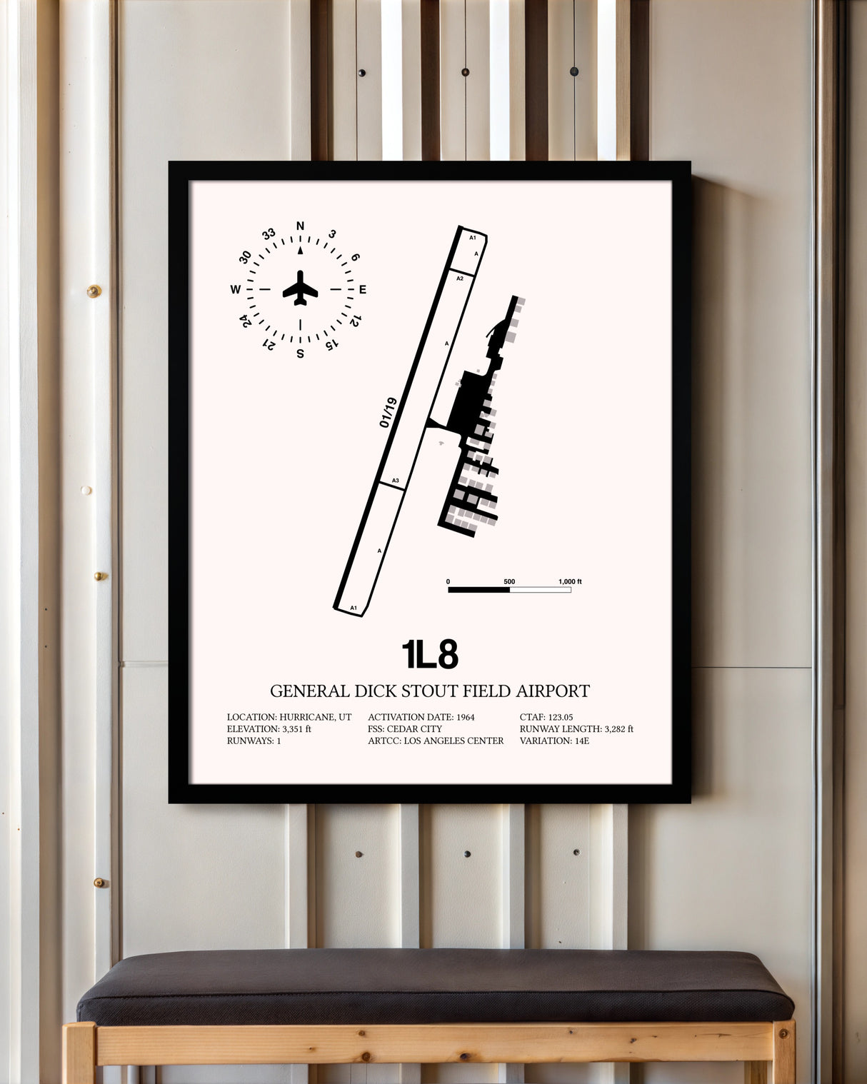 General Dick Stout Field Airport framed poster displayed in an airplane hangar