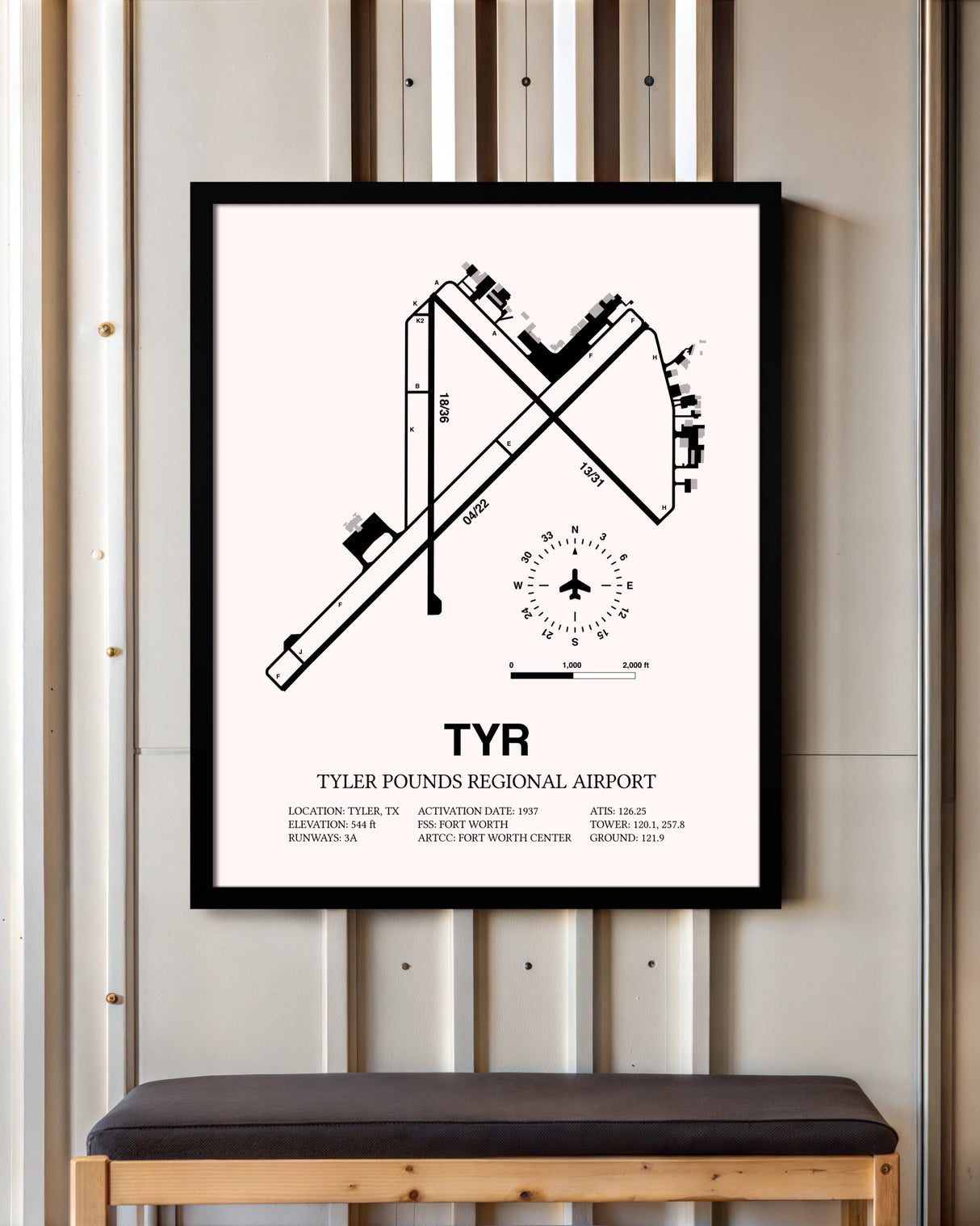 Tyler Pounds Regional Airport framed poster displayed in an airplane hangar