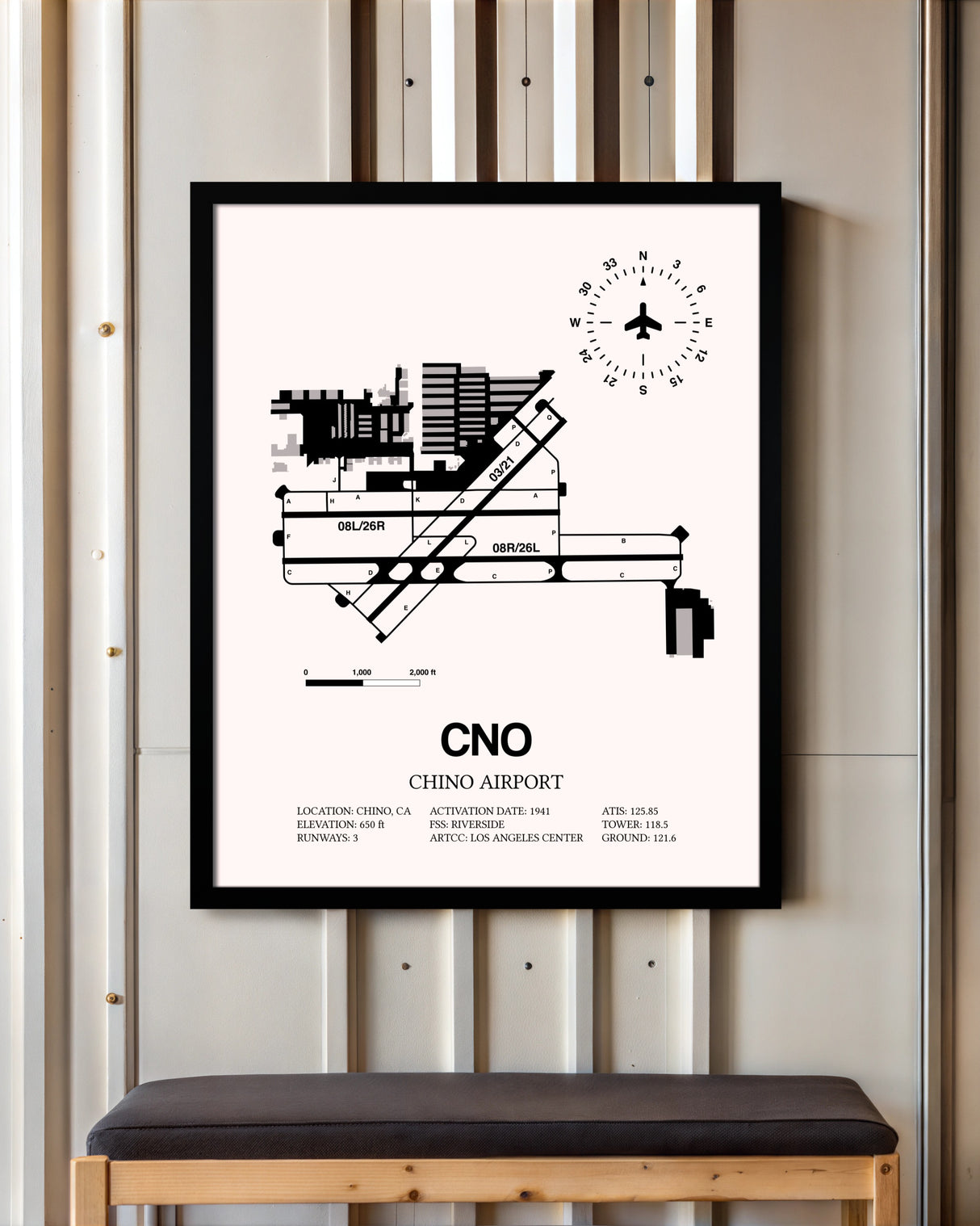 Chino Airport framed poster displayed in an airplane hangar