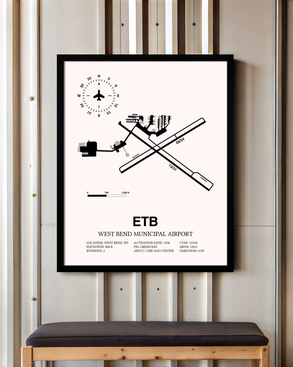 West Bend Municipal Airport framed poster displayed in an airplane hangar