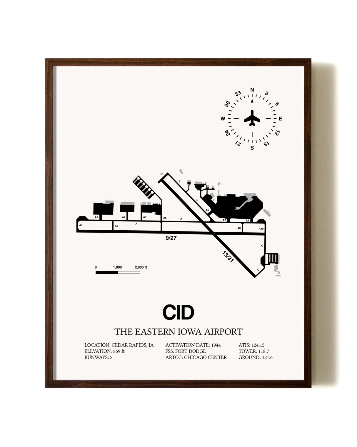 The Eastern Iowa Airport aviation print in walnut frame