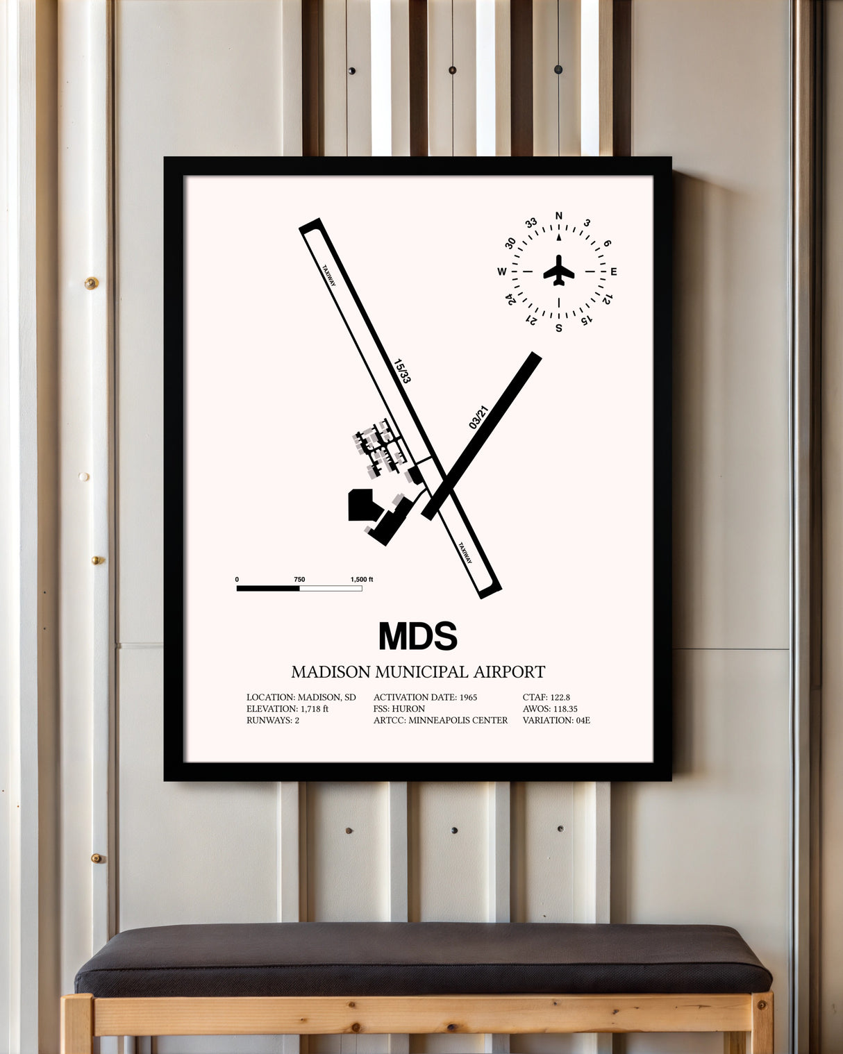 Madison Municipal Airport framed poster displayed in an airplane hangar
