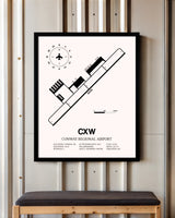 Conway Regional Airport framed poster displayed in an airplane hangar