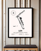 Lake Charles Regional Airport framed poster displayed in an airplane hangar