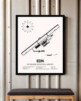 Enterprise Municipal Airport framed poster displayed in an airplane hangar