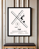 Thief River Falls Regional Airport framed poster displayed in an airplane hangar
