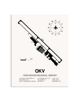 Gray Winchester Regional Airport framed poster displayed in an airplane hangar