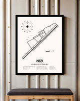 Stormville Airport framed poster displayed in an airplane hangar