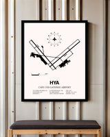 Cape Cod Gateway Airport framed poster displayed in an airplane hangar