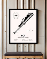 Boca Raton Airport framed poster displayed in an airplane hangar