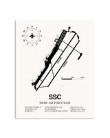 Gray Shaw Air Force Base framed poster displayed in an airplane hangar