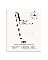 Gray Red Bluff Municipal Airport framed poster displayed in an airplane hangar