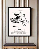 Salinas Municipal Airport framed poster displayed in an airplane hangar