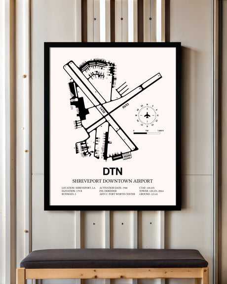 Shreveport Downtown Airport framed poster displayed in an airplane hangar