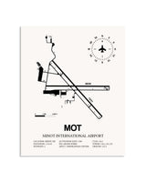 Gray Minot International Airport framed poster displayed in an airplane hangar