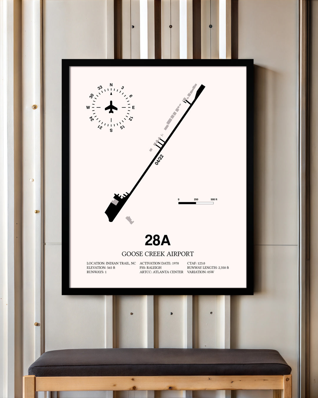 Goose Creek Airport framed poster displayed in an airplane hangar