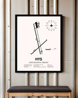 Hays Regional Airport framed poster displayed in an airplane hangar