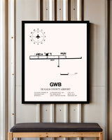De Kalb County Airport framed poster displayed in an airplane hangar