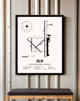 Salina Regional Airport framed poster displayed in an airplane hangar