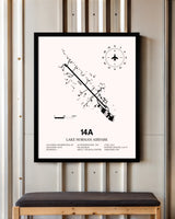 Lake Norman Airpark framed poster displayed in an airplane hangar