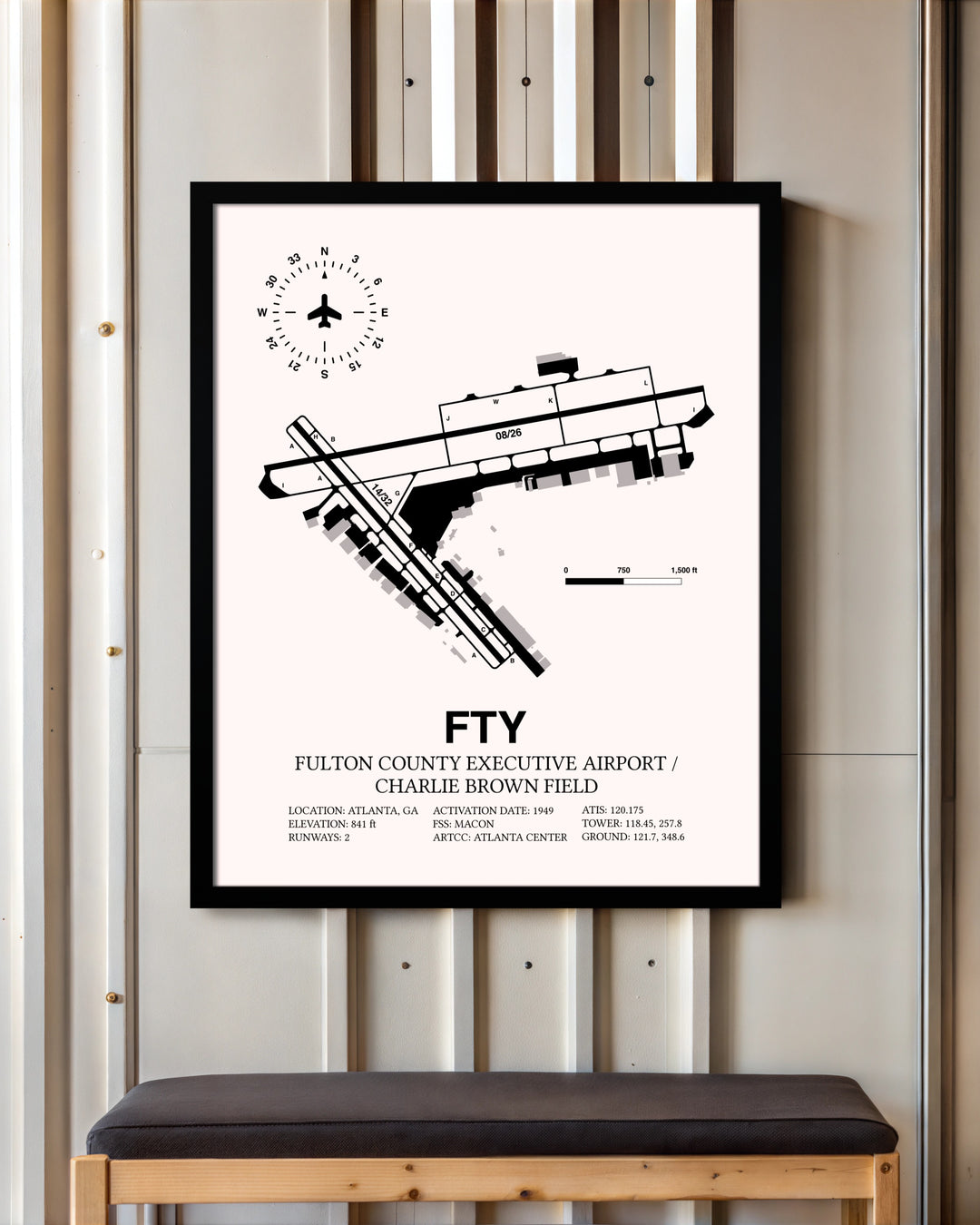 Fulton County Executive Airport / Charlie Brown Field framed poster displayed in an airplane hangar