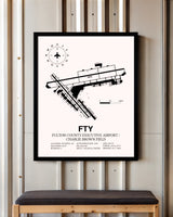 Fulton County Executive Airport / Charlie Brown Field framed poster displayed in an airplane hangar