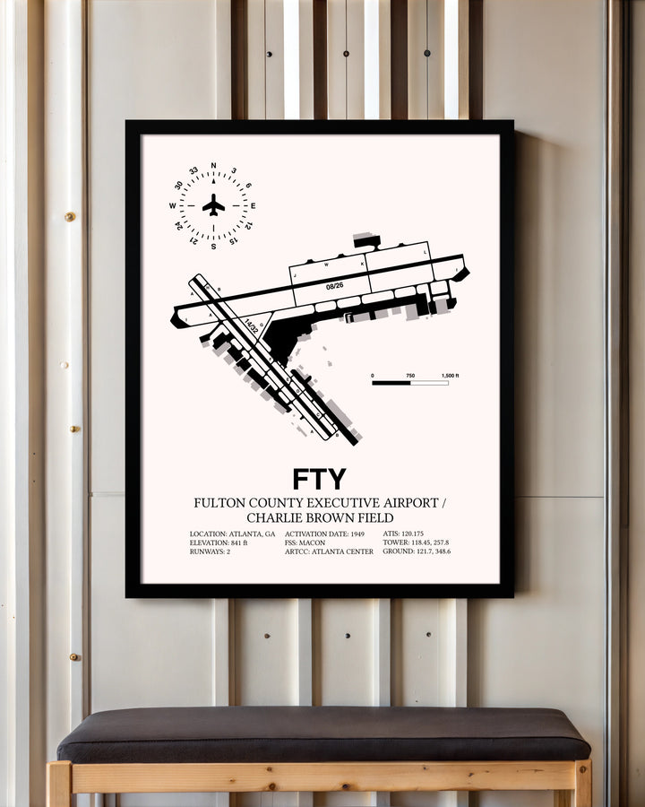 Fulton County Executive Airport / Charlie Brown Field framed poster displayed in an airplane hangar