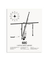 Gray Capitol Drive Airport framed poster displayed in an airplane hangar