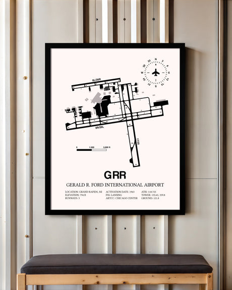 Gerald R. Ford International Airport framed poster displayed in an airplane hangar