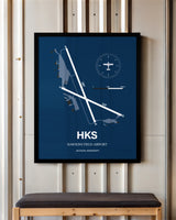 Hawkins Field Airport framed poster displayed in an airplane hangar