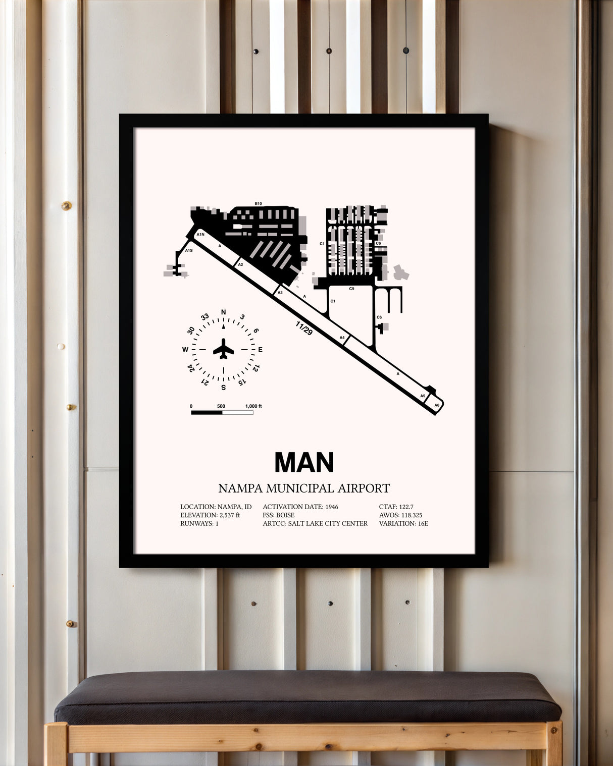 Nampa Municipal Airport framed poster displayed in an airplane hangar