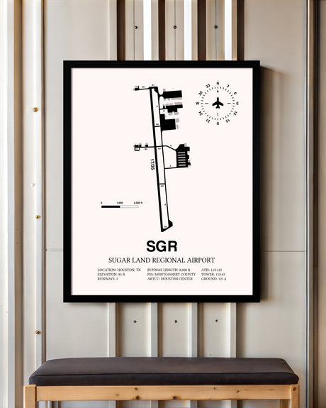 Sugar Land Regional Airport framed poster displayed in an airplane hangar