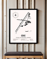 Cedar City Regional Airport framed poster displayed in an airplane hangar