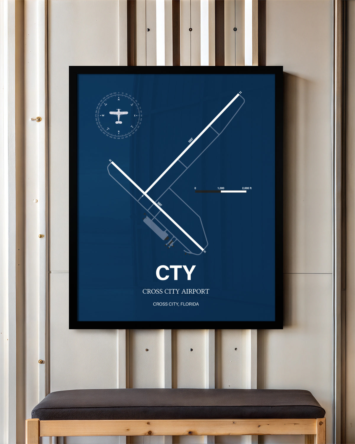Cross City Airport framed poster displayed in an airplane hangar