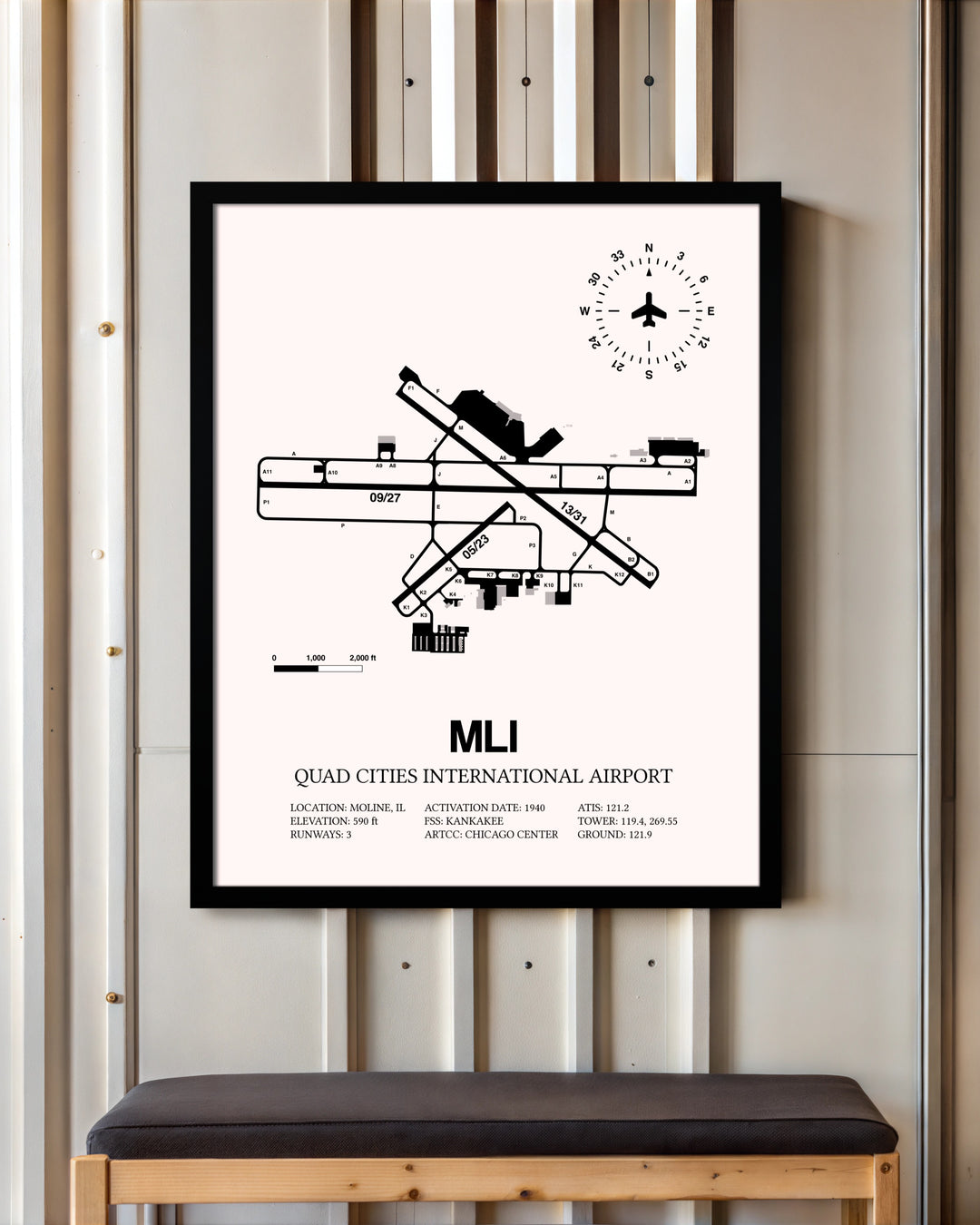 Quad Cities International Airport framed poster displayed in an airplane hangar