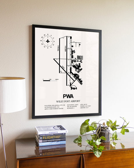 Wiley Post Airport aviation wall décor in black wood frame