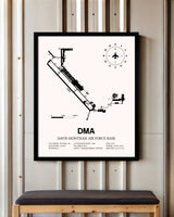 Davis Monthan Air Force Base framed poster displayed in an airplane hangar