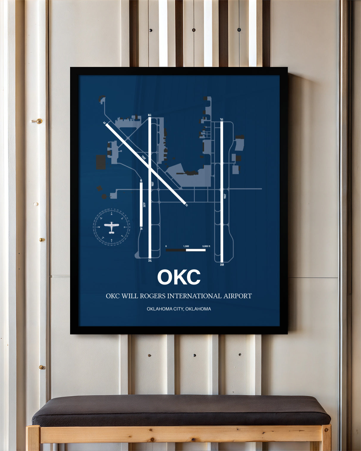 OKC Will Rogers International Airport framed poster displayed in an airplane hangar