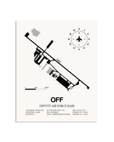 Gray Offutt Air Force Base framed poster displayed in an airplane hangar