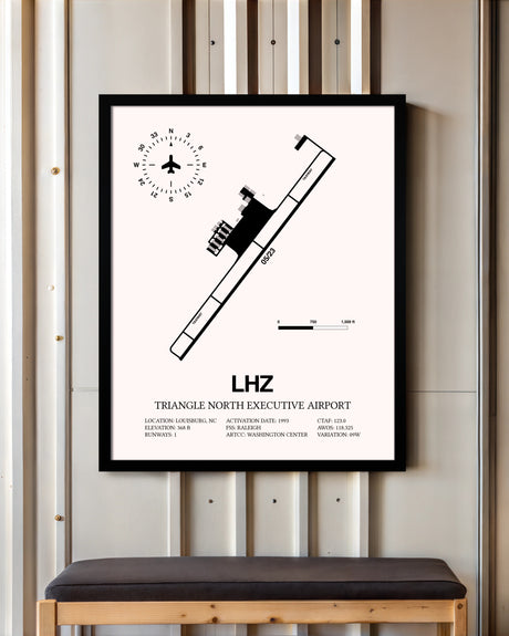 Triangle North Executive Airport framed poster displayed in an airplane hangar
