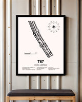 Hicks Airfield framed poster displayed in an airplane hangar