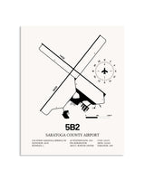 Gray Saratoga County Airport framed poster displayed in an airplane hangar