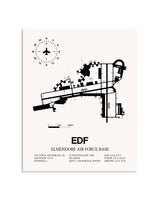 Gray Elmendorf Air Force Base framed poster displayed in an airplane hangar